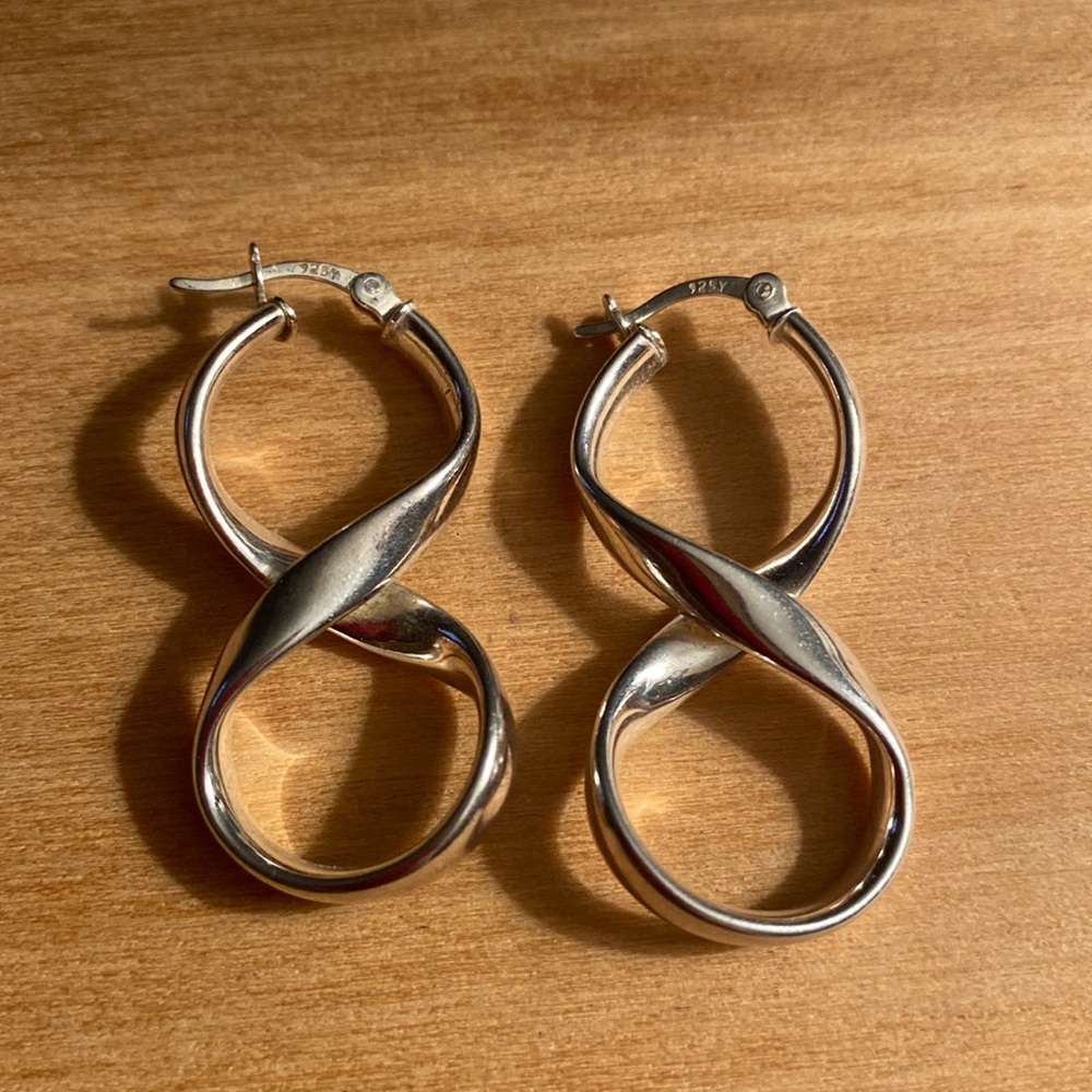 Sterling silver earrings snap down post.